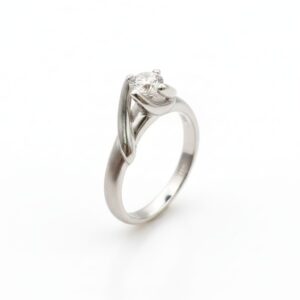 DIAMOND RING - solitaire diamond ring with a tension-style setting.